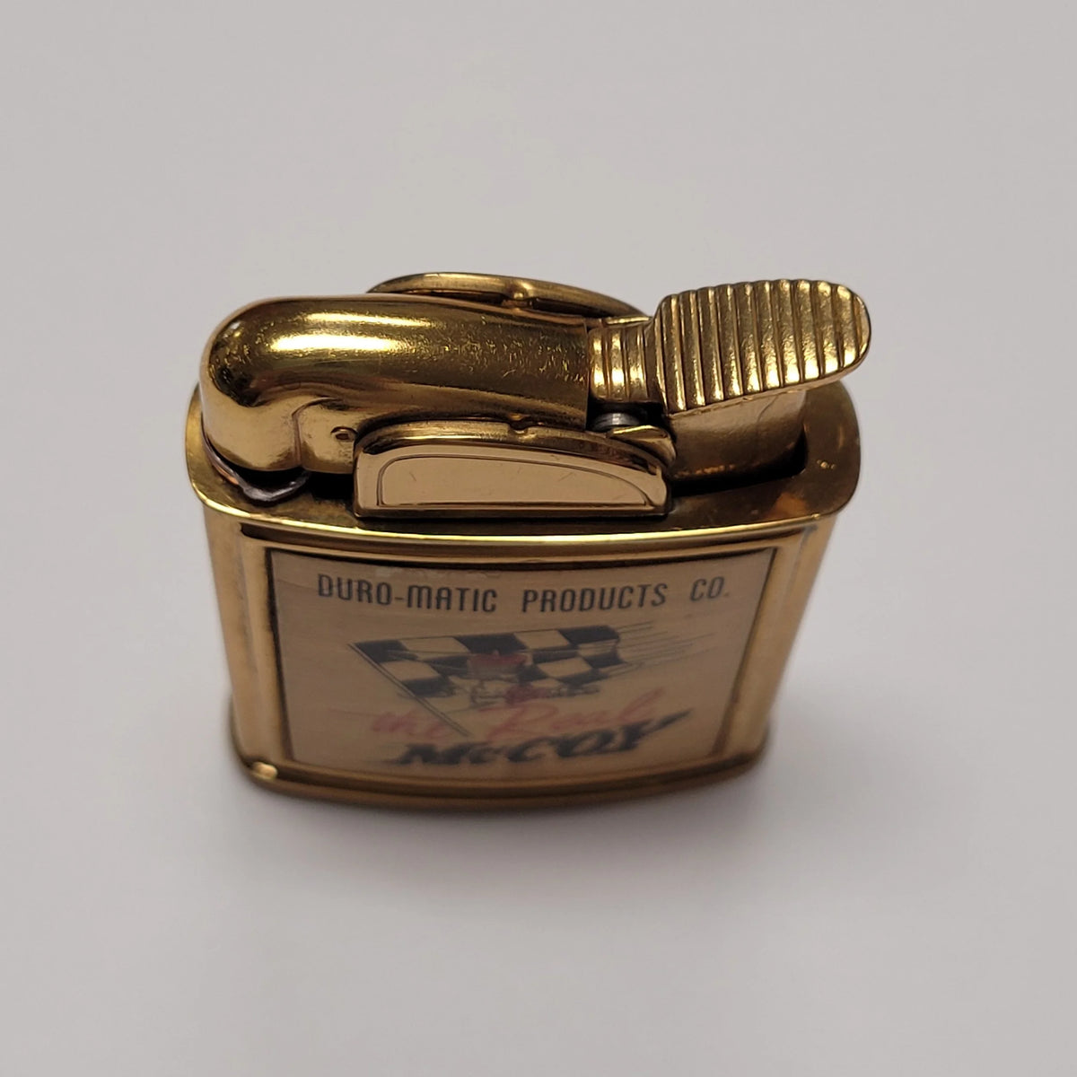 1950s Evans Banner the Real McCoy Pocket Lighter